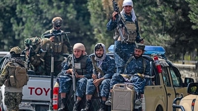 Taliban fighters patrol along a street in Kabul, Afghanistan on Sunday. (AFP)