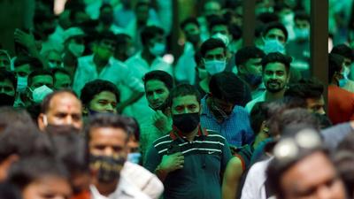People wait to receive a dose of Covid-19 vaccine at a hospital in Noida on August 30. (Reuters)