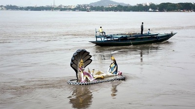 Idol of Lord Vishnu and Goddess Laxmi at the Chakreshwar Temple gets submerged in the water of flooded Brahmaputra River, at Kalipur, in Guwahati. ( ANI) Idol of Lord Vishnu and Goddess Laxmi at the Chakreshwar Temple gets submerged in the water of flooded Brahmaputra River, at Kalipur, in Guwahati. ( ANI)
