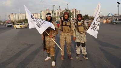 Taliban fighters in military fatigue hold their flags while patrolling the streets in Kabul, Afghanistan. (AP Photo) Taliban fighters in military fatigue hold their flags while patrolling the streets in Kabul, Afghanistan. (AP Photo)