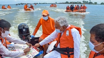 Bihar chief minister Nitish Kumar accompanies a team of NDRF personnel in a boat to the flood-affected areas in Darbhanga on Tuesday. (PTI) Bihar chief minister Nitish Kumar accompanies a team of NDRF personnel in a boat to the flood-affected areas in Darbhanga on Tuesday. (PTI)