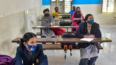 Students attend a class after the Karnataka government re-opened schools to conduct classes for 9 and 10, in Bengaluru. (PTI Photo) Students attend a class after the Karnataka government re-opened schools to conduct classes for 9 and 10, in Bengaluru. (PTI Photo)