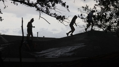 Two deaths have been confirmed as crews began fanning out in boats and off-road vehicles to search communities cut off by the hurricane. (AFP)