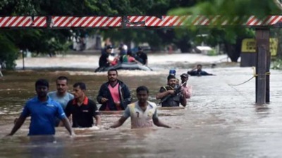 Maharashtra has apprehension that the rise in the water level in the dam could cause damage to the few villages in Sangli and Kolhapur. In this file photo people are sen walking through flooded streets of Sangli in August 2019. (HT photo) Maharashtra has apprehension that the rise in the water level in the dam could cause damage to the few villages in Sangli and Kolhapur. In this file photo people are sen walking through flooded streets of Sangli in August 2019. (HT photo)