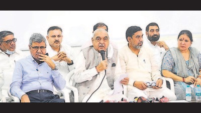 Former Haryana CM Bhupinder Singh Hooda with party MLAs during a press conference in Chandigarh on Tuesday. (Keshav Singh/HT) Former Haryana CM Bhupinder Singh Hooda with party MLAs during a press conference in Chandigarh on Tuesday. (Keshav Singh/HT)