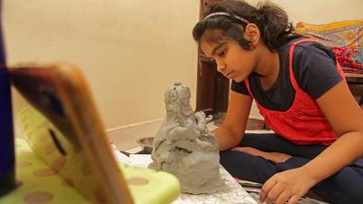 A girl making ecofriendly Ganesh idol from Shadu clay at an online workshop in Pune. Police issue rules for upcoming 10-day festival. (RAVINDRA JOSHI/HT) A girl making ecofriendly Ganesh idol from Shadu clay at an online workshop in Pune. Police issue rules for upcoming 10-day festival. (RAVINDRA JOSHI/HT)