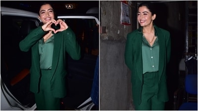 Rashmika wore a silk-satin green button-up shirt underneath the blazer. She totally slayed the formal look by tying her locks in a middle-parted sleek ponytail. For accessories, she chose a chunky gold chain, rings and ear studs. (HT Photo/Varinder Chawla) Rashmika wore a silk-satin green button-up shirt underneath the blazer. She totally slayed the formal look by tying her locks in a middle-parted sleek ponytail. For accessories, she chose a chunky gold chain, rings and ear studs. (HT Photo/Varinder Chawla)