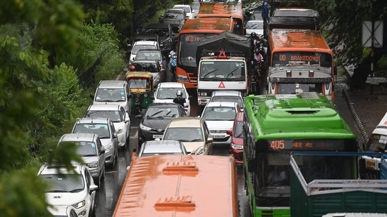 An overview of vehicles stuck in a traffic snarl after heavy rains in New Delhi on August 31.(AFP)