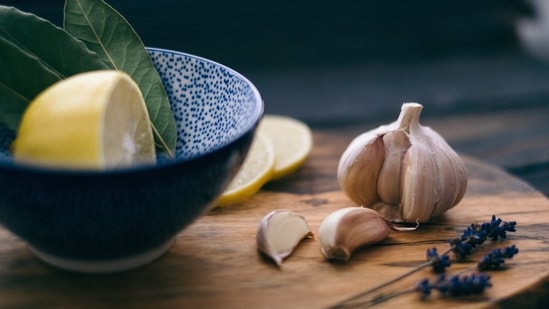 Reduce blood pressure: The compounds found in garlic helps reduce high blood pressure.(Unsplash)