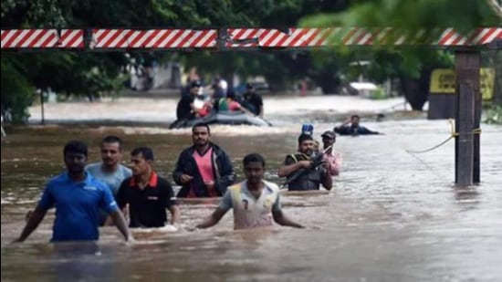 Maharashtra has apprehension that the rise in the water level in the dam could cause damage to the few villages in Sangli and Kolhapur. In this file photo people are sen walking through flooded streets of Sangli in August 2019. (HT photo) Maharashtra has apprehension that the rise in the water level in the dam could cause damage to the few villages in Sangli and Kolhapur. In this file photo people are sen walking through flooded streets of Sangli in August 2019. (HT photo)