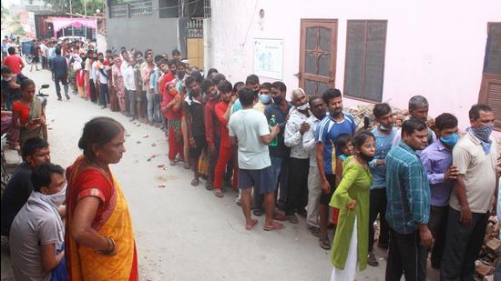 Beneficiaries not adhering to social distancing norms, wait in queues to receive Covid-19 vaccine dose at a vaccination camp, in Gurugram on August 31. (PTI) Beneficiaries not adhering to social distancing norms, wait in queues to receive Covid-19 vaccine dose at a vaccination camp, in Gurugram on August 31. (PTI)