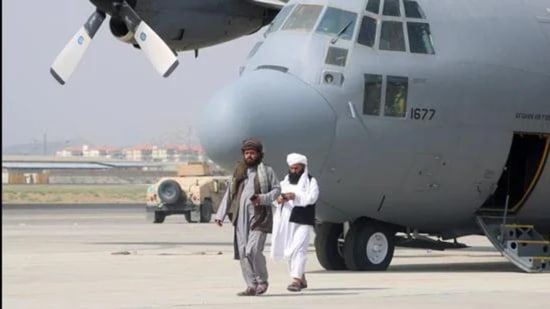Taliban walk in front of a military plane a day after the US troops’ withdrawal from Hamid Karzai International Airport n Kabul, Afghanistan on August 31, 2021. (REUTERS) Taliban walk in front of a military plane a day after the US troops’ withdrawal from Hamid Karzai International Airport n Kabul, Afghanistan on August 31, 2021. (REUTERS)