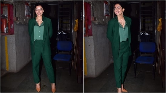 Rashmika wore a notch lapel tailored blazer in a dark green hue, featuring faux pockets on both sides and long sleeves. She teamed it with coordinated high waist straight-fit pants and looked elegant.(HT Photo/Varinder Chawla)