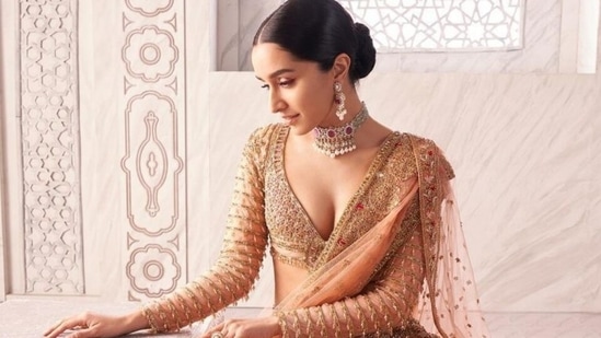 Shraddha Kapoor in coral lehenga and plunging-neck blouse serves regal look for the modern bride(Instagram/@shraddhakapoor)