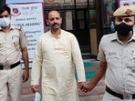 Pinki Chaudhary reached Mandir Marg police station around 2:30pm on Tuesday, where over 100 of his supporters lifted him on their shoulders, and took him inside the police station. (PTI) Pinki Chaudhary reached Mandir Marg police station around 2:30pm on Tuesday, where over 100 of his supporters lifted him on their shoulders, and took him inside the police station. (PTI)