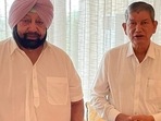 Punjab chief minister Capt Amarinder Singh with AICC general secretary and in-charge of Congress affairs in the state Harish Rawat at former’s farmhouse in Siswan near Chandigarh on Wednesday. (HT photo) Punjab chief minister Capt Amarinder Singh with AICC general secretary and in-charge of Congress affairs in the state Harish Rawat at former’s farmhouse in Siswan near Chandigarh on Wednesday. (HT photo)