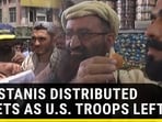 PAKISTANIS DISTRIBUTED SWEETS AS U.S TROOPS LEFT