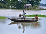 (Top) People travel in a boat through a flooded field in Assam’s Morigaon district on Wednesday. (Above) The roof of a house collapsed due to a landslide after heavy rainfall in Thane. Reuters (Top) People travel in a boat through a flooded field in Assam’s Morigaon district on Wednesday. (Above) The roof of a house collapsed due to a landslide after heavy rainfall in Thane. Reuters