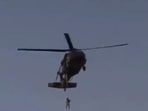 Screengrab of the video that went viral claiming the Taliban hanged a man from a helicopter in Kandahar. (Twitter)