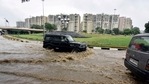 Vehicles wade through a water logged stretch after heavy rains at AIIMS in New Delhi.(Sanjeev Verma/HT PHOTO) Vehicles wade through a water logged stretch after heavy rains at AIIMS in New Delhi.(Sanjeev Verma/HT PHOTO)