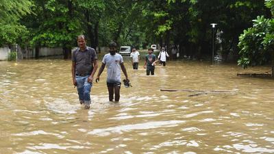 Pedestrians wade their way around near Galleria Market as heavy rainfall left the road waterlogged. (Vipin Kumar/HT PHOTO) Pedestrians wade their way around near Galleria Market as heavy rainfall left the road waterlogged. (Vipin Kumar/HT PHOTO)
