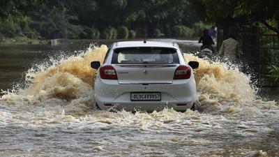 Vehicles wade through a waterlogged stretch near Sector 22 in Delhi’s Dwarka locality. (Vipin Kumar/HT PHOTO) Vehicles wade through a waterlogged stretch near Sector 22 in Delhi’s Dwarka locality. (Vipin Kumar/HT PHOTO)