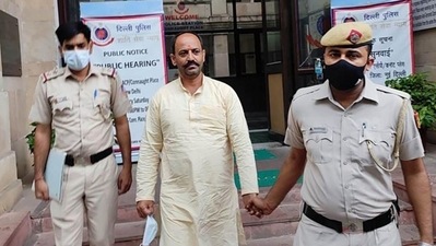 Pinki Chaudhary reached Mandir Marg police station around 2:30pm on Tuesday, where over 100 of his supporters lifted him on their shoulders, and took him inside the police station. (PTI) Pinki Chaudhary reached Mandir Marg police station around 2:30pm on Tuesday, where over 100 of his supporters lifted him on their shoulders, and took him inside the police station. (PTI)