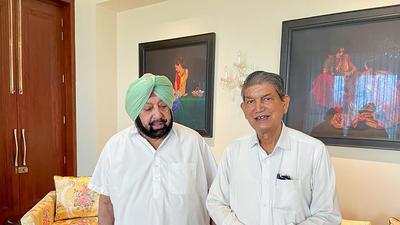 Captain Amarinder Singh with Congress general secretary in-charge of state Harish Rawat. (PTI) Captain Amarinder Singh with Congress general secretary in-charge of state Harish Rawat. (PTI)