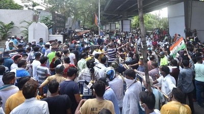 TMC workers gather outside the CBI office at Nizam Palace in protest against the arrest of party ministers and MLAs in connection with the Narada sting case, in Kolkata. (PTI  file photo)