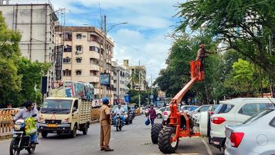 Trees cut during peak hours on East Street in Camp in Pune, on Wednesday. (Rahul Raut/HT PHOTO)