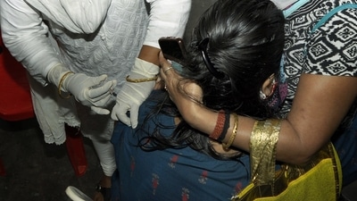 A beneficiary receives a dose of the COvid-19 vaccine at a centre in Guwahati. (ANI Photo)