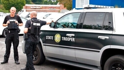Police blocked roads to the school, which has an enrollment of more than 1,500 students, and numerous emergency vehicles were on the scene. (AP Photo/Skip Foreman) (AP) Police blocked roads to the school, which has an enrollment of more than 1,500 students, and numerous emergency vehicles were on the scene. (AP Photo/Skip Foreman) (AP)