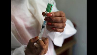A paramedic prepares to inject a shot of Covid-19 vaccine during a vaccination drive in Srinagar. (Waseem Andrabi//HT)