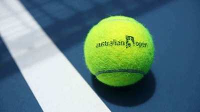 An Australian Open branded tennis ball is seen on court. (Getty Images) An Australian Open branded tennis ball is seen on court. (Getty Images)