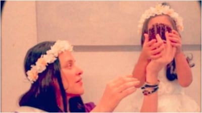 Neha Dhupia feeds her firstborn Mehr Angad Dhupia a slice of cake as mother and daughter twin in floral headbands. (Instagram/@nehadhupia) Neha Dhupia feeds her firstborn Mehr Angad Dhupia a slice of cake as mother and daughter twin in floral headbands. (Instagram/@nehadhupia)