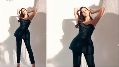 Nora Fatehi styled herself in a black tube top that looks like a blazer and teamed it with black pants and printed heels. (Instagram/@norafatehi) Nora Fatehi styled herself in a black tube top that looks like a blazer and teamed it with black pants and printed heels. (Instagram/@norafatehi)