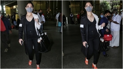 Tamannaah paired her classy look with minimal accessories. She chose a layered gold gain, matching hoop earrings, and stacked bracelets. In the end, she added a pop of colour to the monochrome look with strappy orange pumps. (HT Photo/Varinder Chawla)
