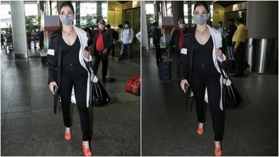 The Baahubali actor layered her all-black outfit with a dual-toned monochrome notch lapel trench coat. The jacket featured a black hue on one side and white, on the other, with contrasting stripes on each sleeve. (HT Photo/Varinder Chawla) The Baahubali actor layered her all-black outfit with a dual-toned monochrome notch lapel trench coat. The jacket featured a black hue on one side and white, on the other, with contrasting stripes on each sleeve. (HT Photo/Varinder Chawla)