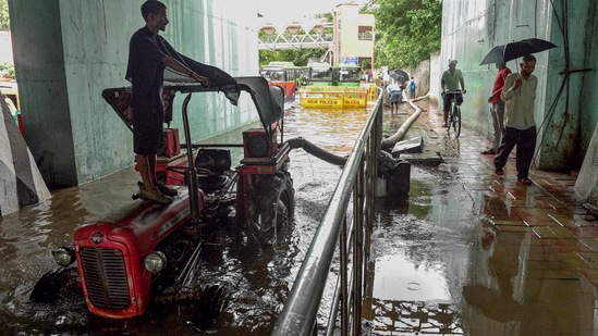 A pump set being used to remove water from the waterlogged Tilak Marg, near ITO in New Delhi,.(PTI)