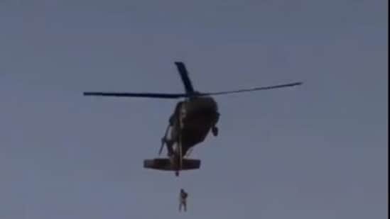 Screengrab of the video that went viral claiming the Taliban hanged a man from a helicopter in Kandahar. (Twitter)