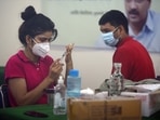 A healthcare worker prepares a dose of Covid-19 vaccine, at a government school in New Delhi on Thursday. A healthcare worker prepares a dose of Covid-19 vaccine, at a government school in New Delhi on Thursday.