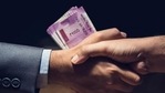Businessmen making handshake in dark private room with money, Indian Rupee currency, in hands - bribery and corruption concept (Getty Images/iStockphoto) Businessmen making handshake in dark private room with money, Indian Rupee currency, in hands - bribery and corruption concept (Getty Images/iStockphoto)