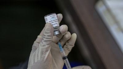 Thane Municipal Corporation has covered 1 million population in the vaccination drive by administering at least one dose to 470,000 women and 530,000 men. (Bloomberg file photo) Thane Municipal Corporation has covered 1 million population in the vaccination drive by administering at least one dose to 470,000 women and 530,000 men. (Bloomberg file photo)