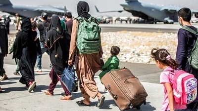 Families walk towards their flight during ongoing evacuations at Hamid Karzai International Airport, in Kabul, Afghanistan. (File photo) (AP) Families walk towards their flight during ongoing evacuations at Hamid Karzai International Airport, in Kabul, Afghanistan. (File photo) (AP)