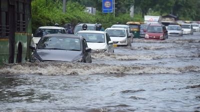 Commuters wade through a waterlogged stretch near ITO on Thursday morning. (Photo by Raj K Raj / Hindustan Times) Commuters wade through a waterlogged stretch near ITO on Thursday morning. (Photo by Raj K Raj / Hindustan Times)