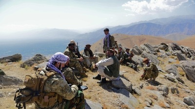 Afghan resistance movement and anti-Taliban uprising forces take rest as they patrol on a hilltop in Darband area in Anaba district, (AFP)