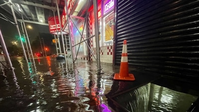 Rainfall from Hurricane Ida flood the basement of a Kennedy Fried Chicken fast food restaurant. (AFP)