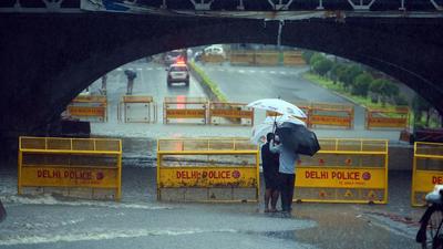 Police barricades placed at a waterlogged stretch near Minto Bridge, in New Delhi on Wednesday. (Raj K Raj / Hindustan Times) Police barricades placed at a waterlogged stretch near Minto Bridge, in New Delhi on Wednesday. (Raj K Raj / Hindustan Times)