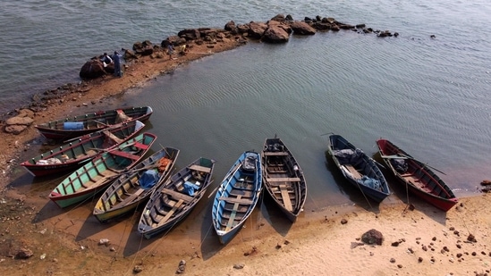 Boats of fishermen are seen on the shore of the Parana River during a historic downspout in Corrientes, Argentina. The river, which runs through Brazil, Paraguay and Argentina, is suffering its worst downspout in over half a century - a phenomenon believed to be the result of climate change.(AFP Photo)