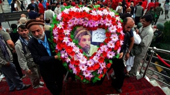 Afghans carry a wreath of flowers during a ceremony commemorating the 11th anniversary of the death of Ahmad Shah Massoud in Kabul.(AP File Photo) Afghans carry a wreath of flowers during a ceremony commemorating the 11th anniversary of the death of Ahmad Shah Massoud in Kabul.(AP File Photo)